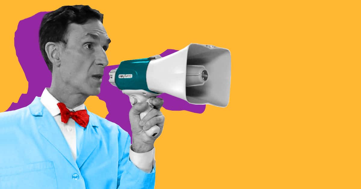 A man in a lab coat utilizing candidate engagement with a megaphone.