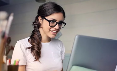 A full-time employee is working on a laptop.