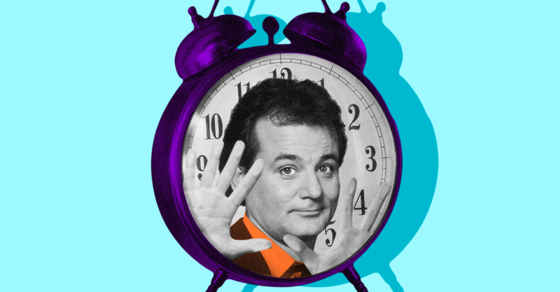 A clock with a man's face on it.