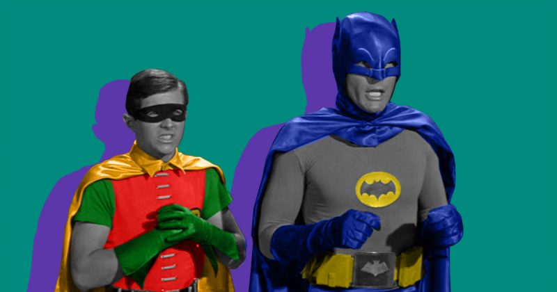 Two superhero disguises, Batman and Robin, engaged in a side-by-side pose.